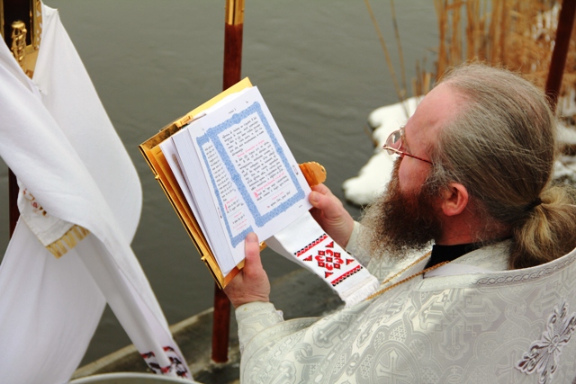 Praying before blessing the water 