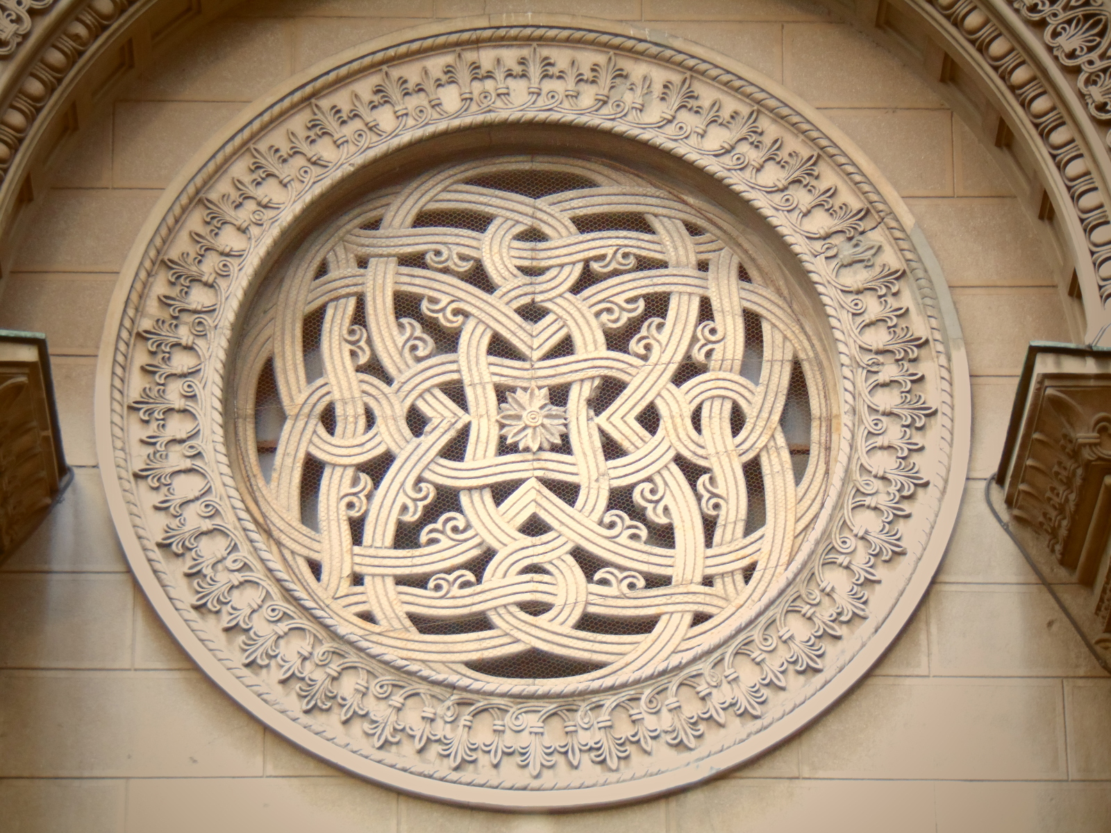 Rosette in stone plastic