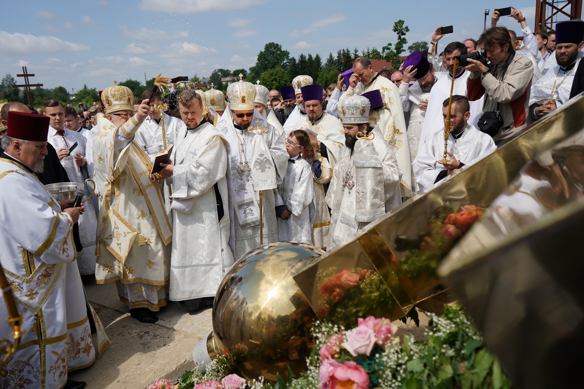 Blessing and elevation of main cross on the roof of Hagia Sophia Orthodox church in Warsaw