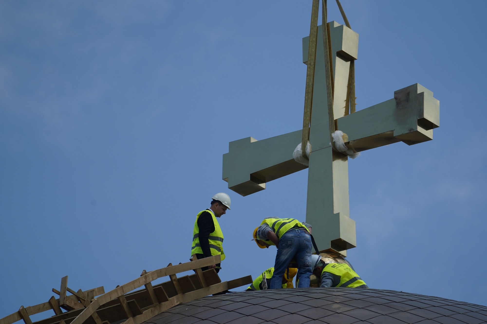 Blessing and elevation of main cross on the roof of Hagia Sophia Orthodox church in Warsaw