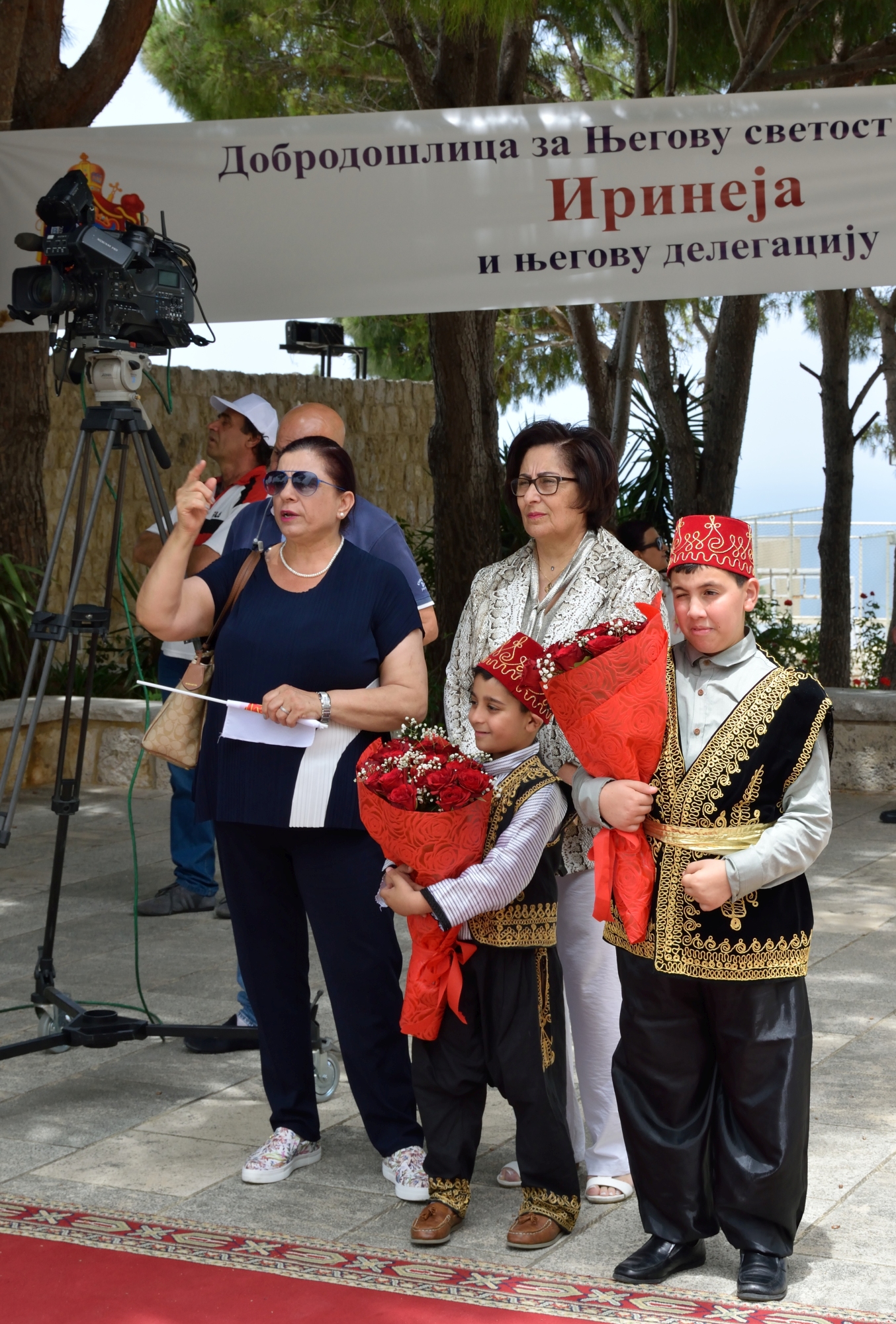 Orthodox Lebanese children in traditional costumes greeting Serbian patriarch