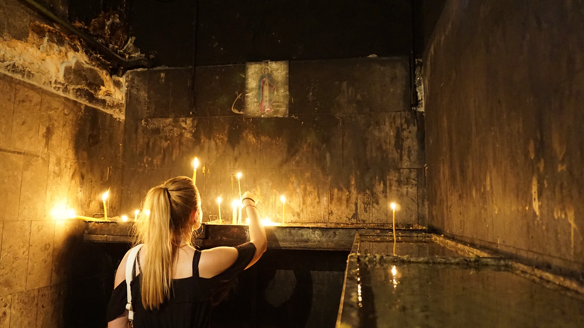 Praying girl with candle