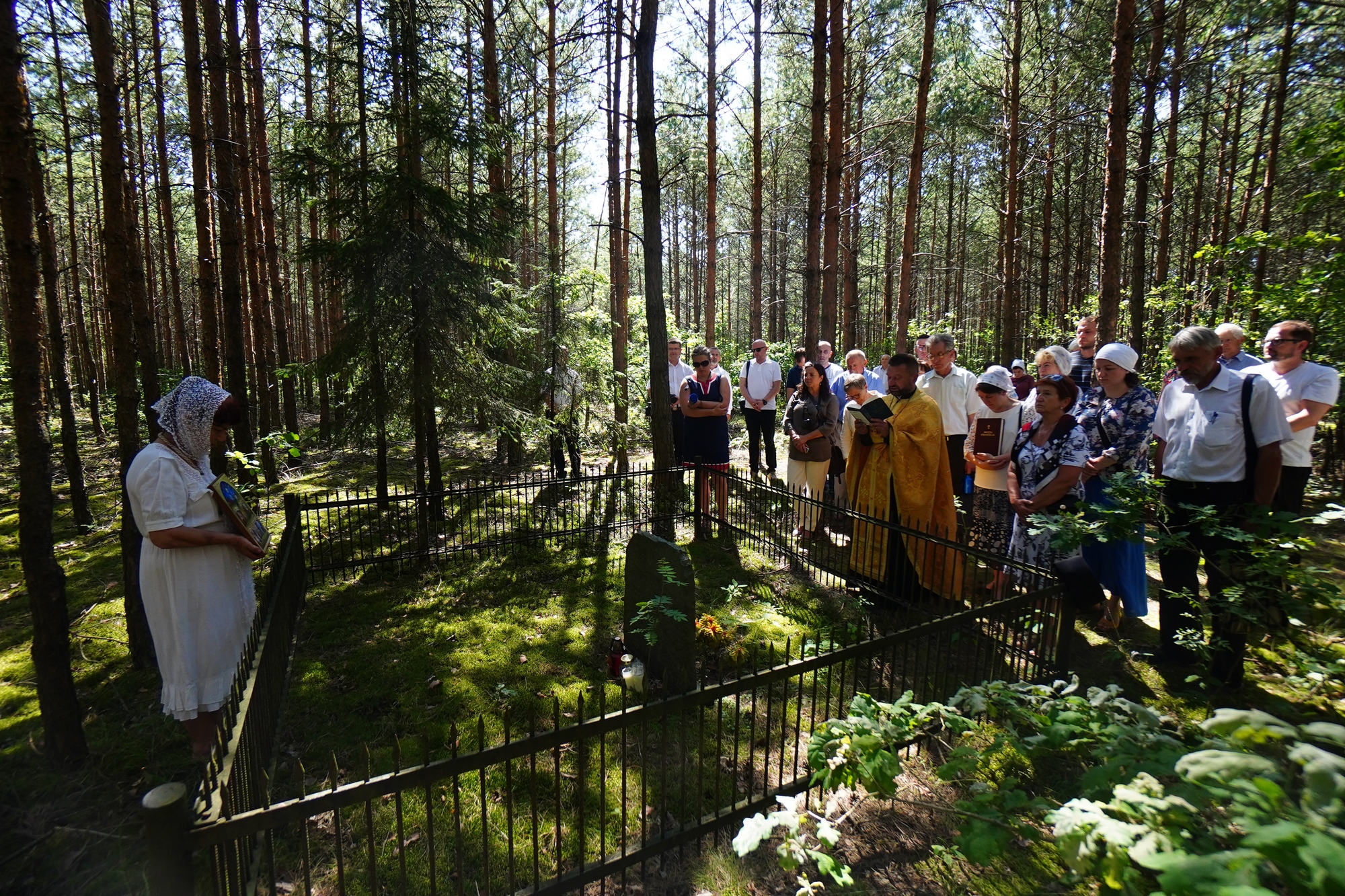 The prayer in the wood at Podlasie Martyrs grave close to Puchały Stare