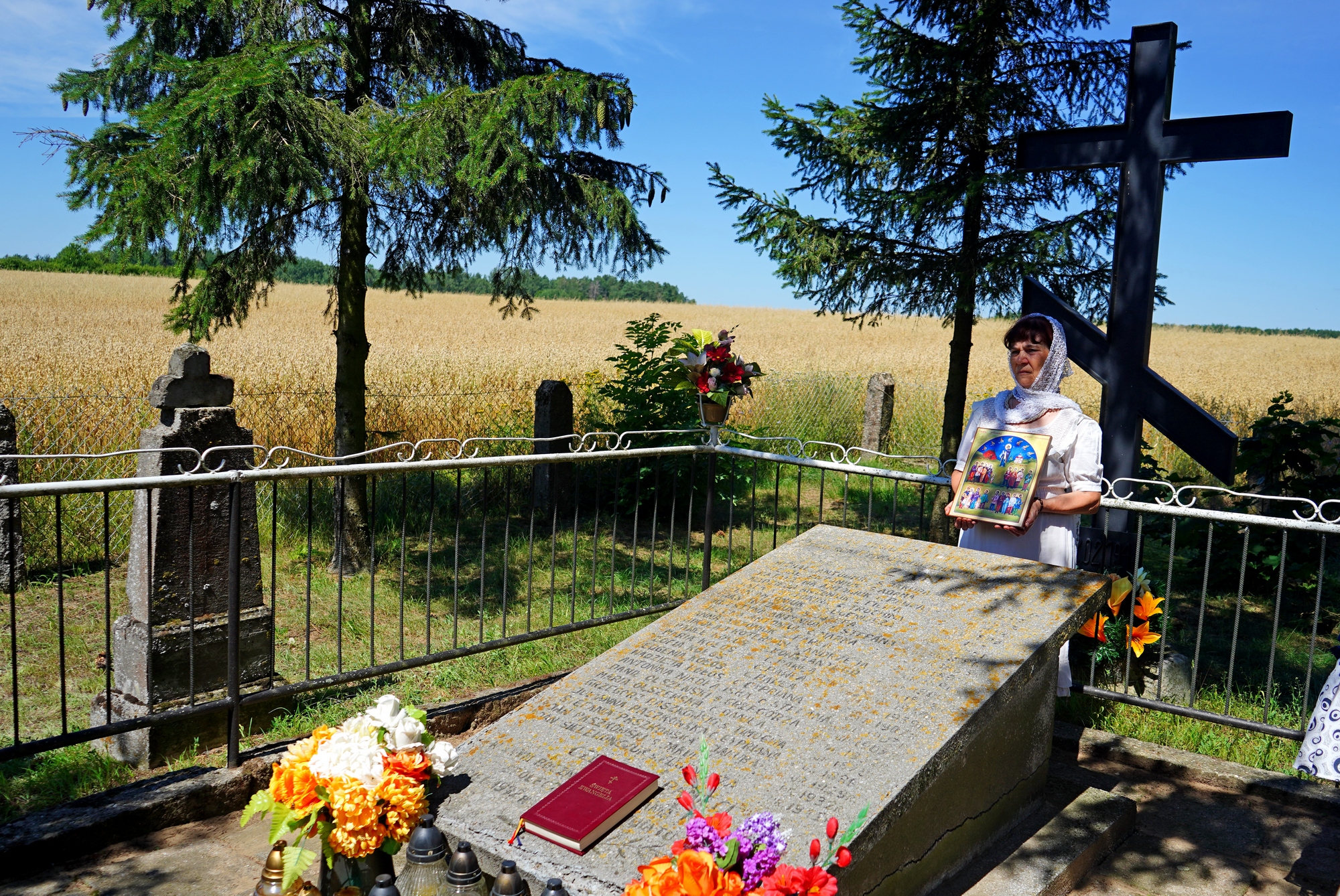 The prayer at Podlasie Martyrs grave close to Zanie village