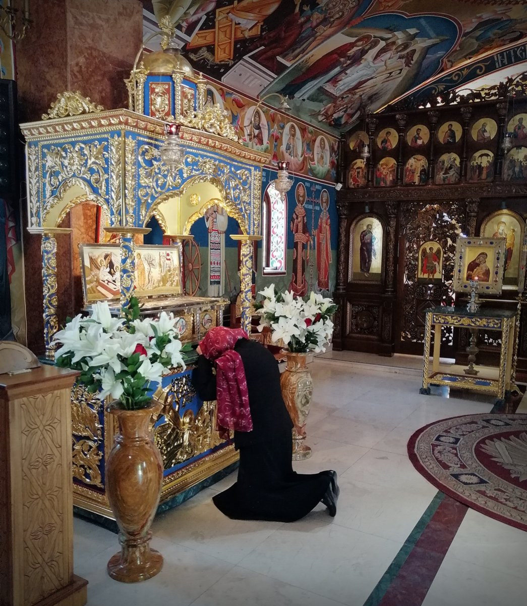 Deep prayer at the relics of Saint Mary Magdalene