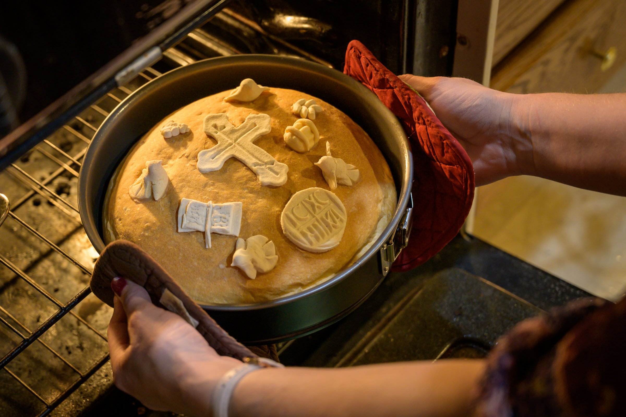 Baking the slavski kolač for the Slava of St. Sebastian of Jacksoni