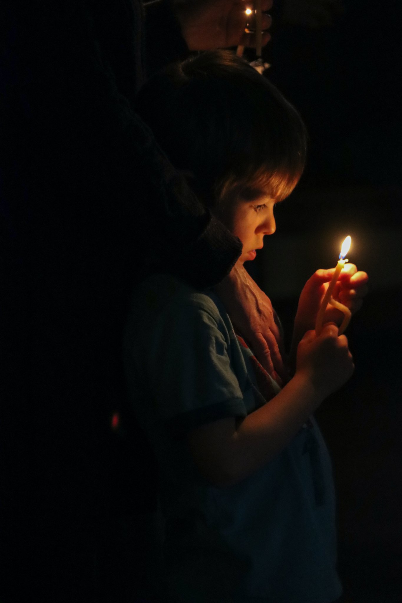 child with candle