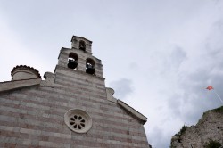 Sheep1389 
 An Orthodox church and Montenegrin flag, Budva 2024