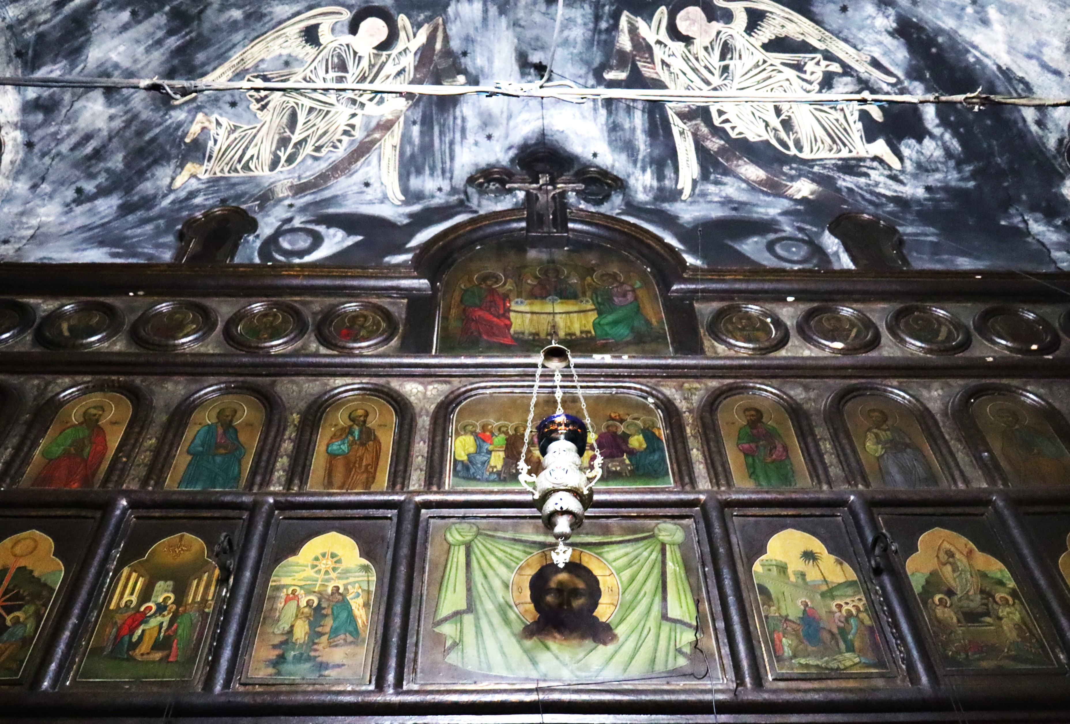 Iconostasis and an old fresco 