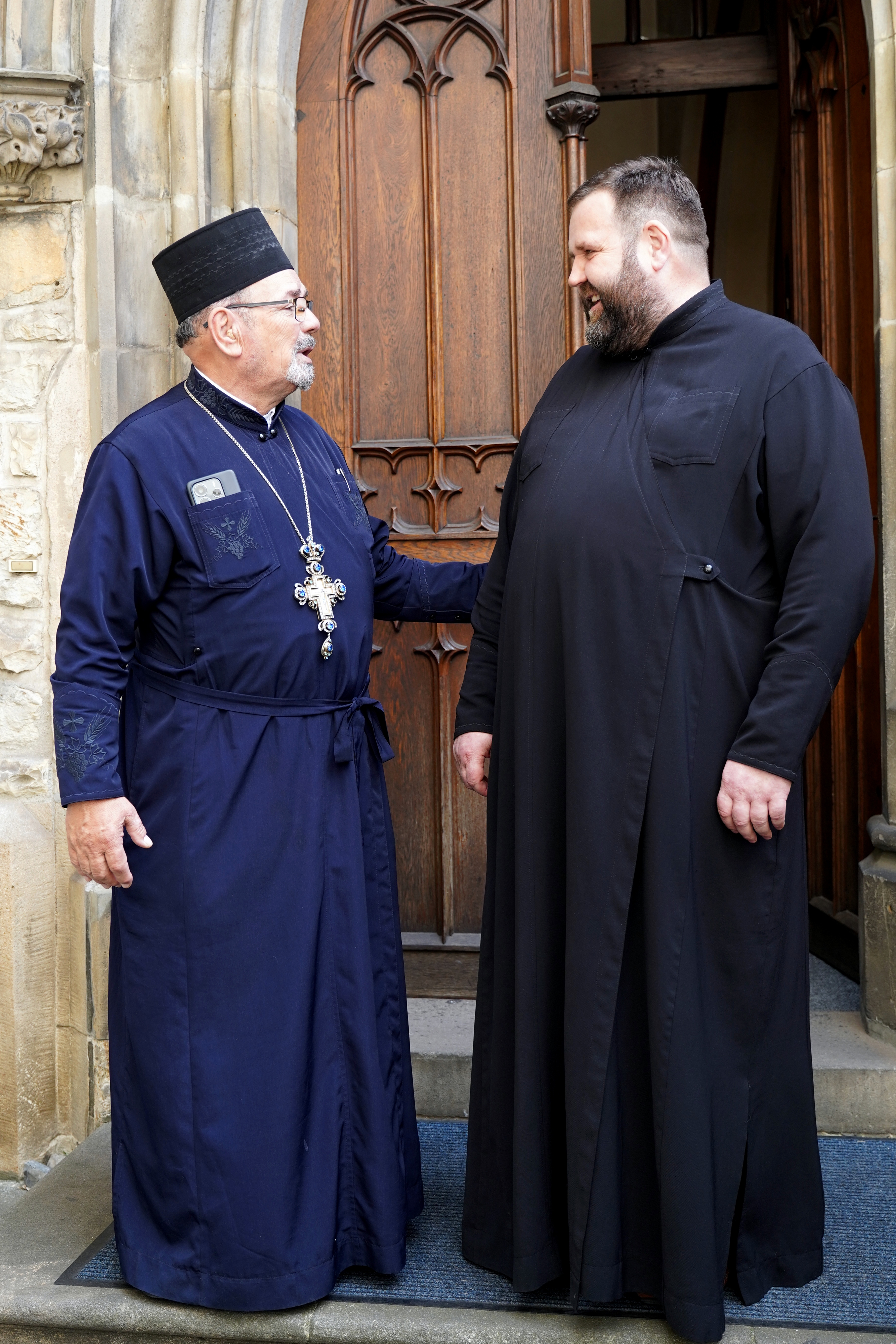 Priests in front of the Annunciation Orthodox chruch in Prague