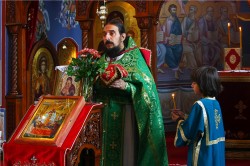 felix 
 Father and son at the Holy Liturgy in Serbian small town Razana
